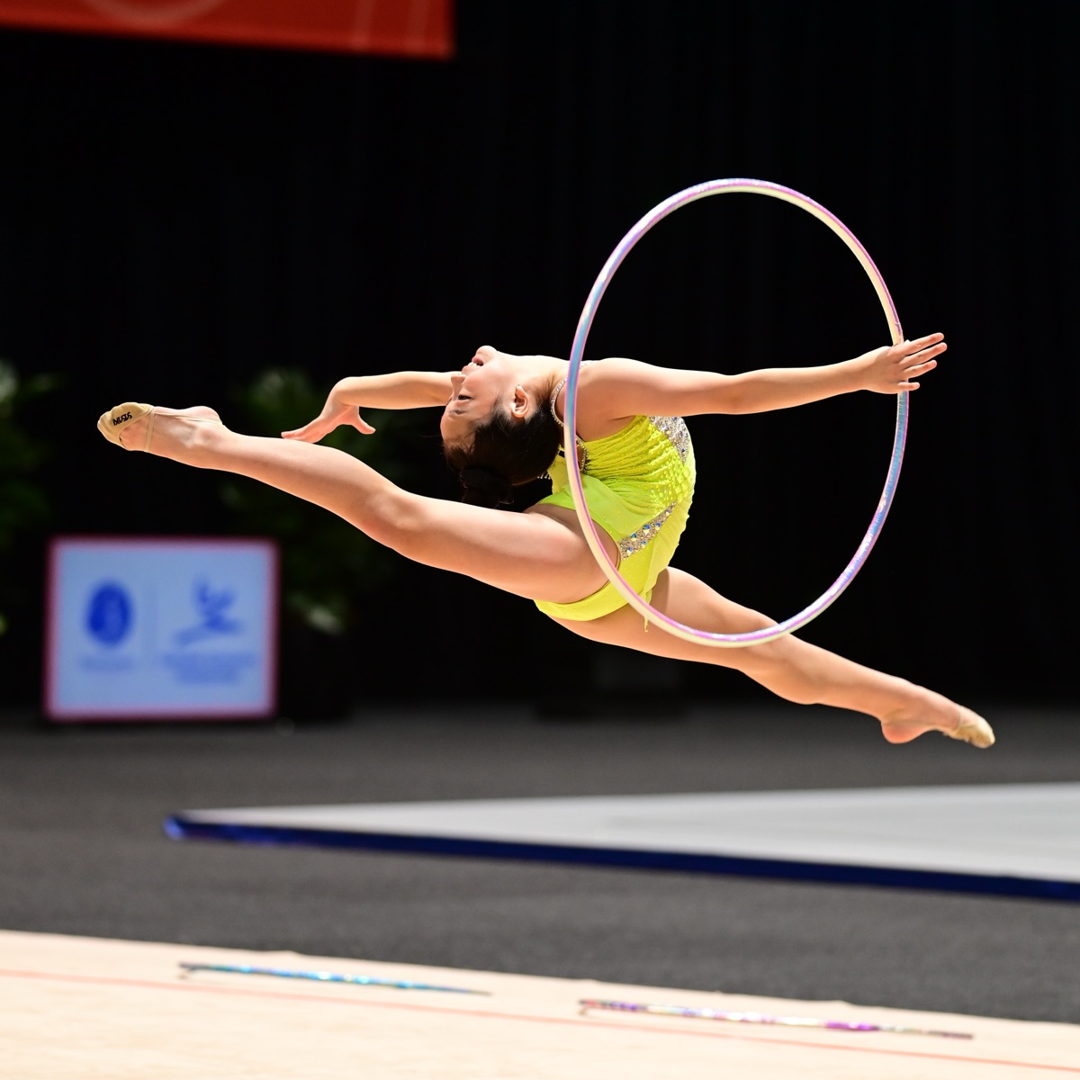Rhythmic gymnast performing with a hoop